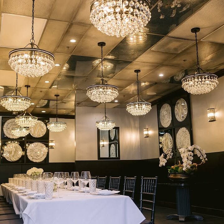 Elegant dining room with crystal chandeliers.